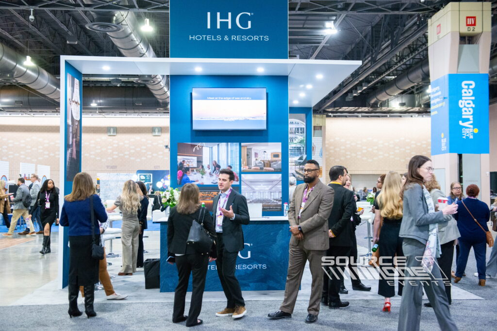 Wide convention floor view highlighting Source One Events installations, custom exhibits, and branded experiential environments.