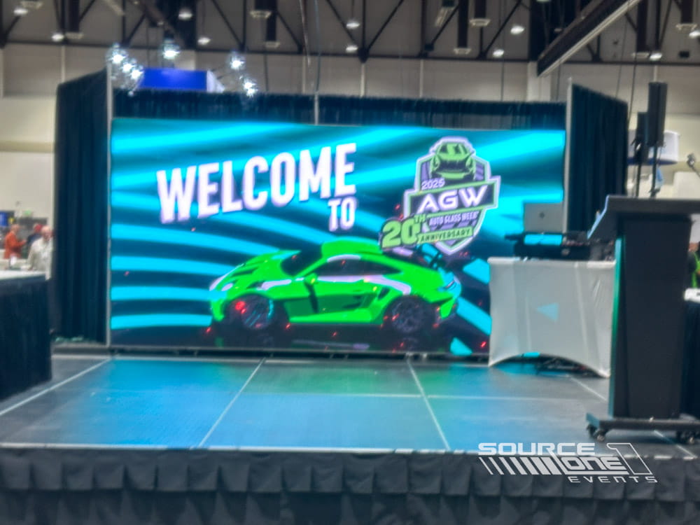 Bright high-resolution LED display showcasing welcome messaging and event branding for conference attendees.