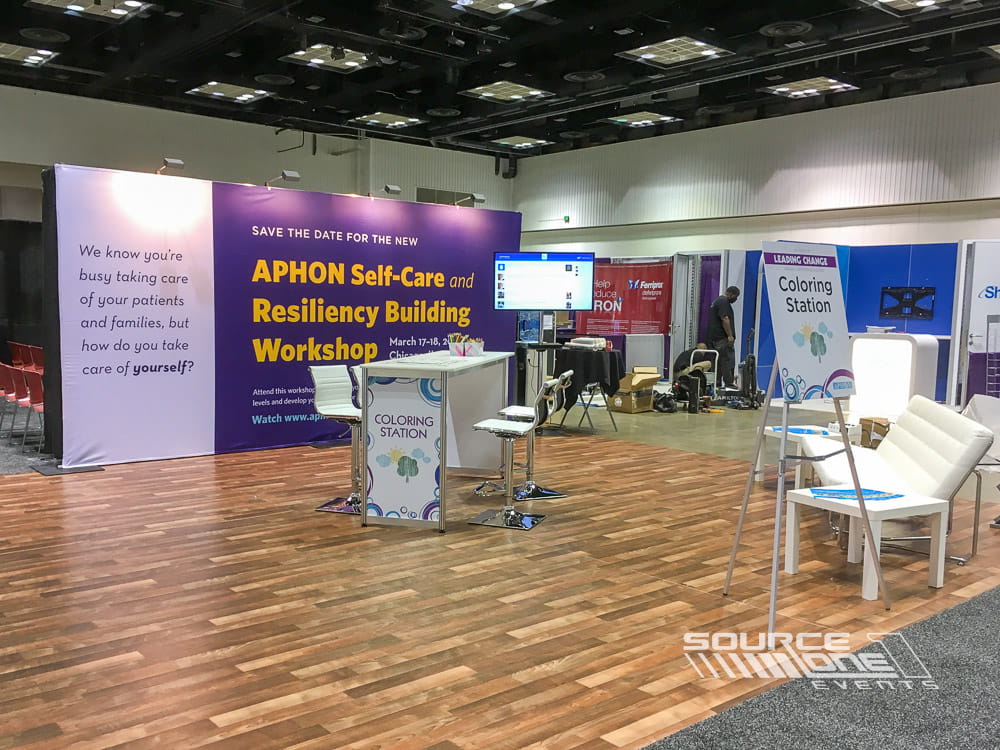 Custom APHON trade show exhibit featuring branded graphics and attendee meeting space.