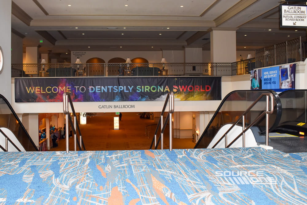 Overhead ballroom entrance banner with conference branding suspended above the Gatlin Ballroom entrance.