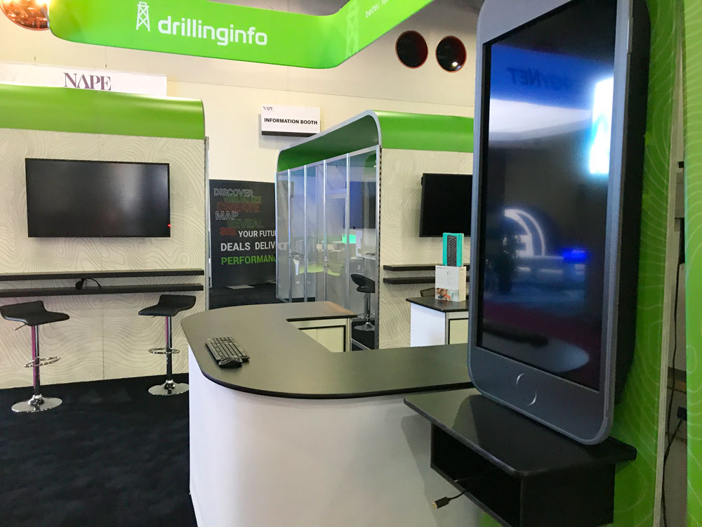 Custom exhibit booth with branded displays, meeting space, and product demonstrations.