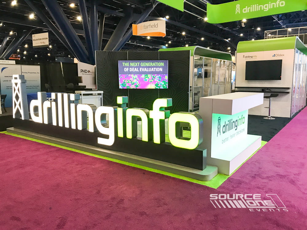 Interactive custom trade show booth showcasing branded architecture, technology demonstrations, and visitor engagement spaces.