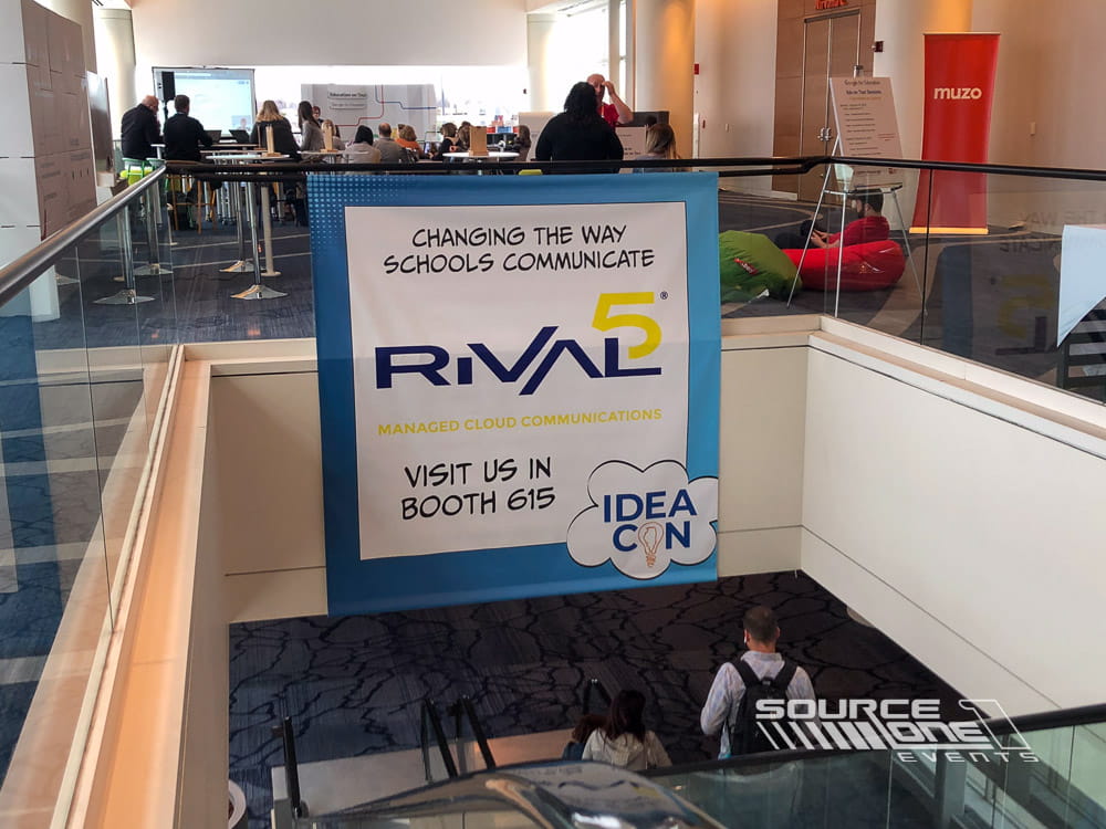 Hanging conference banner promoting IDEAcon with bold branding suspended above the convention hall for attendee navigation.