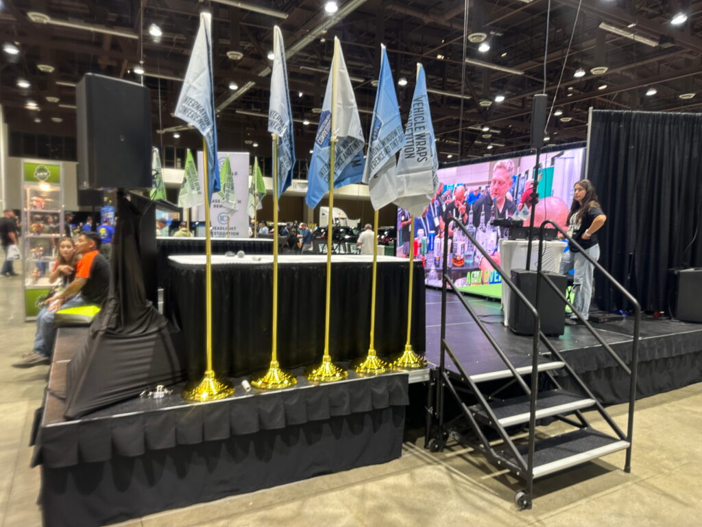 Flag display outside a trade show exhibit booth