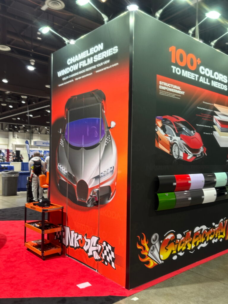 High-impact vehicle display with oversized promotional graphics, LED messaging, and custom exhibit architecture.