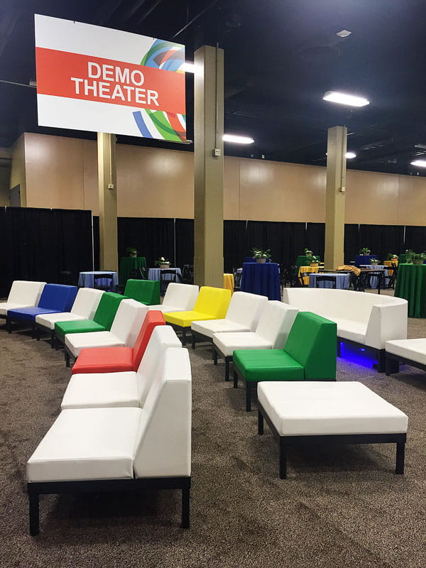 Colorful modern lounge furniture creating collaborative meeting space at conference