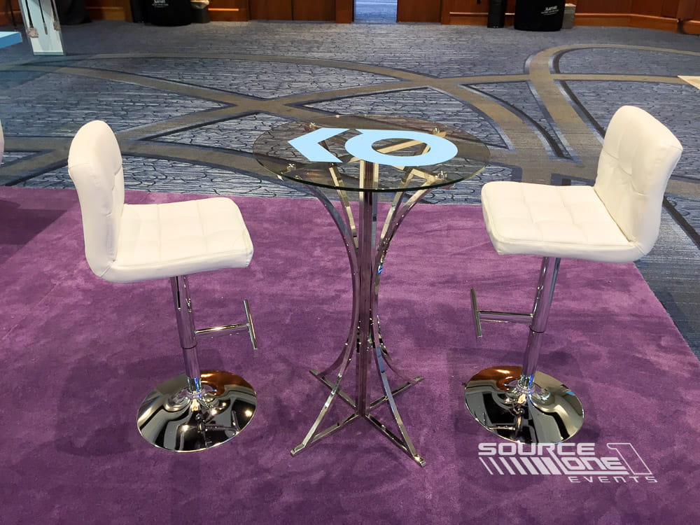 Branded tabletop graphics enhancing the attendee experience at an Intuit event.