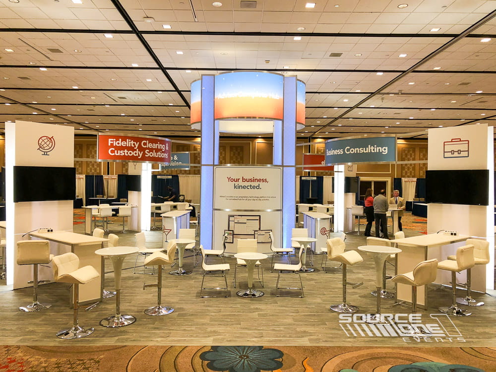Large custom exhibit showcasing premium exhibit fabrication, illuminated branding, and visitor engagement areas.