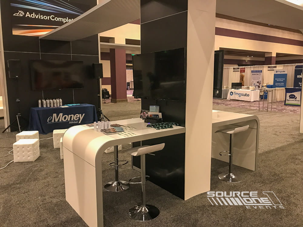 Custom networking station with integrated display monitor and modern meeting furniture.