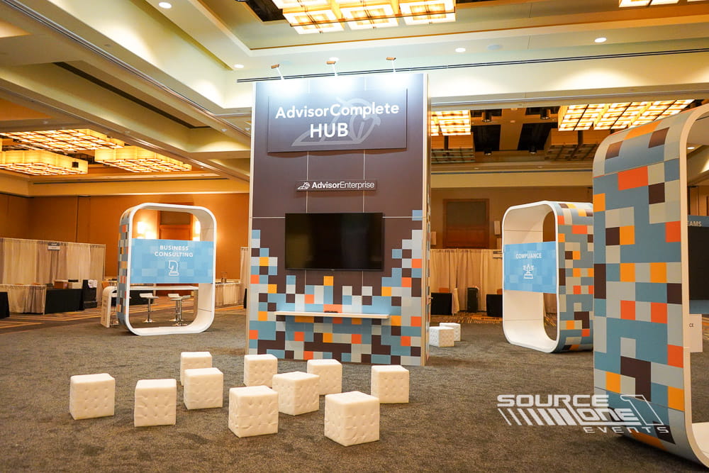 Modern custom exhibit featuring illuminated graphics, premium exhibit construction, and collaborative meeting environment.