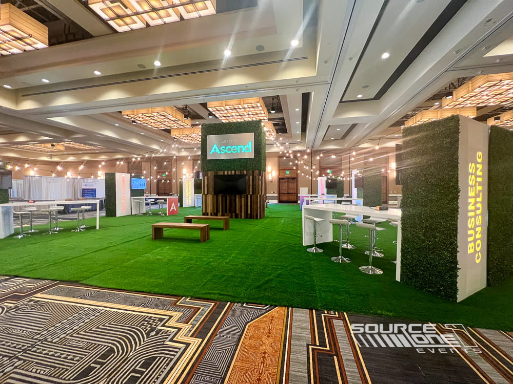 Custom networking environment with integrated branding, modern furnishings, and open collaborative meeting spaces.