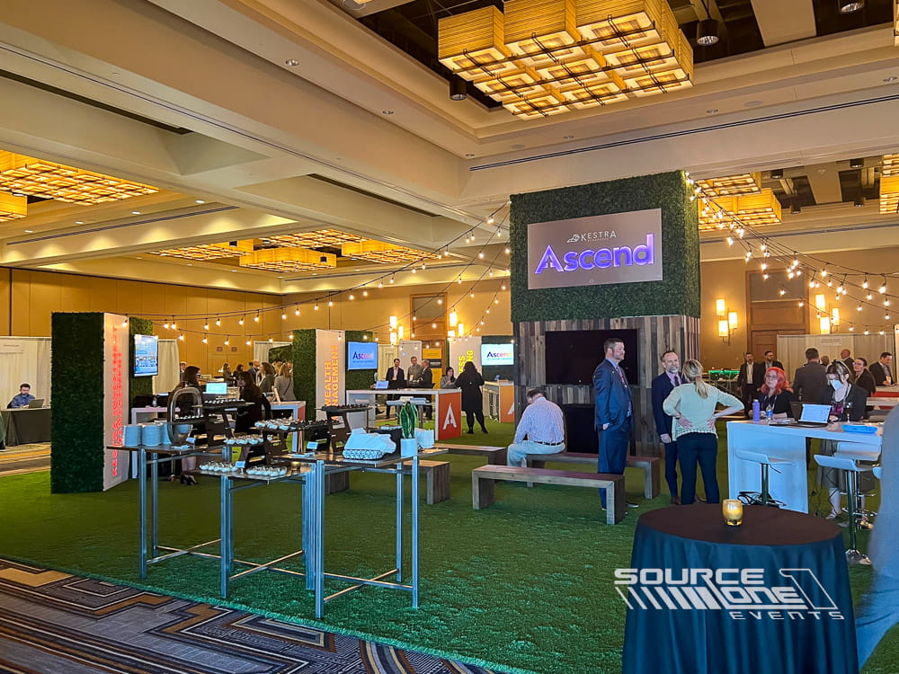 Large branded networking pavilion with custom architectural elements designed for meetings, collaboration, and attendee engagement.