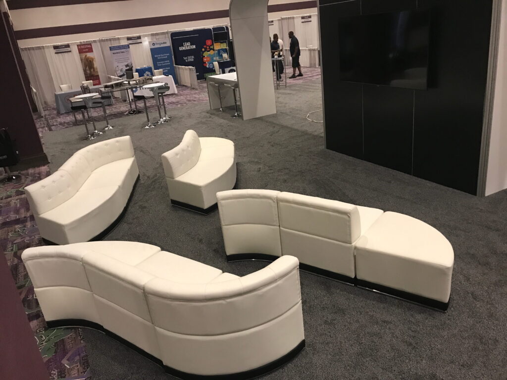 Custom modular white event lounge furniture in convention center networking space