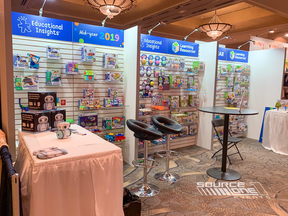 Bright retail-inspired custom exhibit displaying colorful educational products with engaging merchandising and branded graphics.