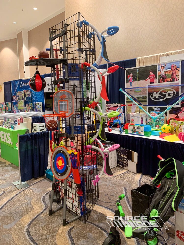 Interactive retail exhibit featuring colorful merchandise displays designed to maximize product visibility and attendee engagement.