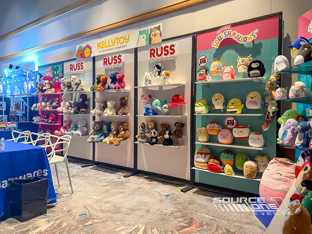Colorful retail-inspired custom trade show booth featuring branded shelving, merchandise displays, and engaging shopping experience.