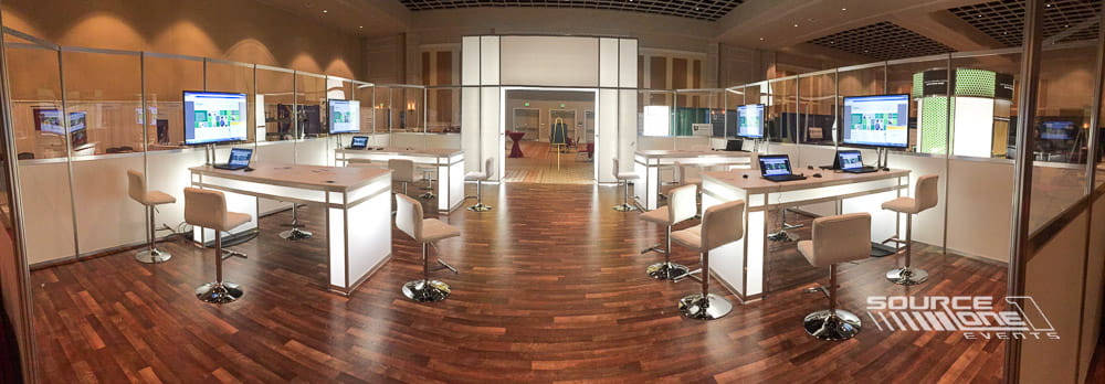 Spacious networking environment with café seating, open floor plan, and conference hospitality design.