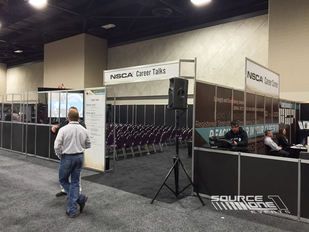 Dedicated career education room featuring presentation seating, branded signage, and professional development space during a conference.