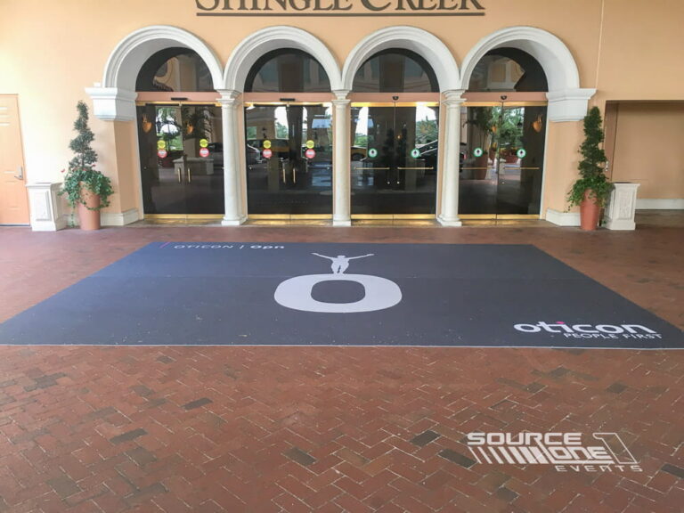 Custom outdoor event flooring installed at the entrance to an event venue.