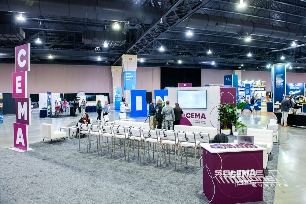 Oversized freestanding CEMA letters with colorful event branding serving as a landmark activation and attendee photo destination.