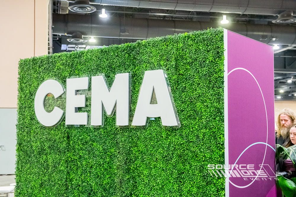 Custom CEMA exhibit featuring branded environmental graphics and attendee engagement space.
