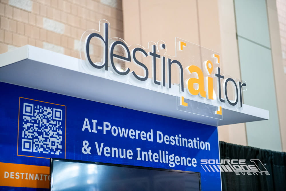 Large custom destination-themed 3D letters creating an interactive conference display.