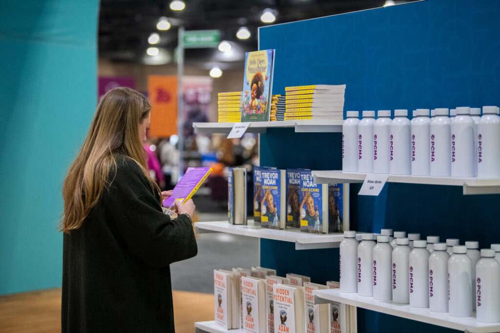 Interactive museum and retail exhibit featuring branded displays for conference attendees.