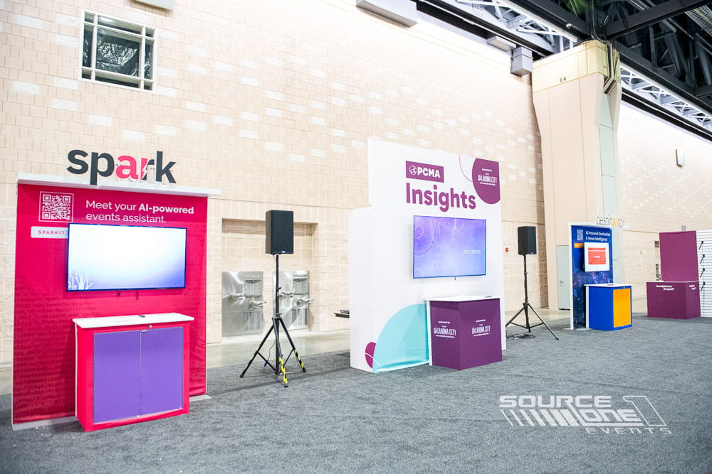 Custom Spark exhibit booth featuring branded graphics and attendee engagement space.
