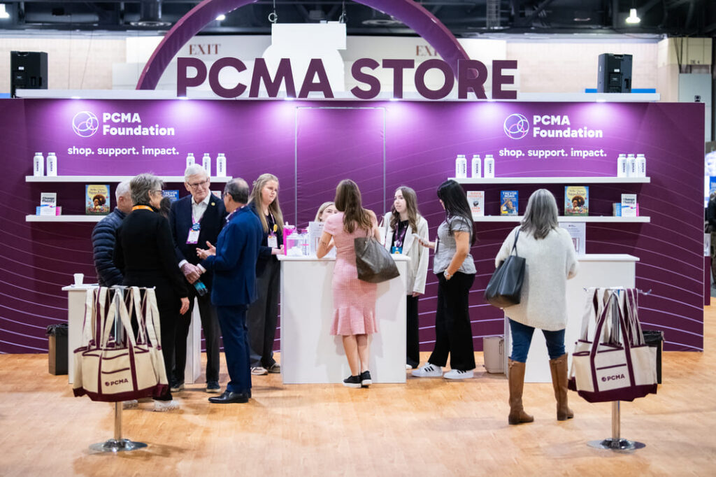 Custom IHG exhibit booth designed for attendee engagement at a conference.