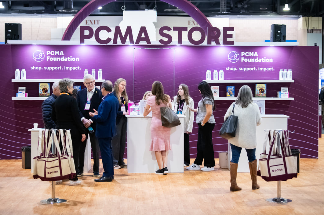 Custom IHG exhibit booth designed for attendee engagement at a conference.