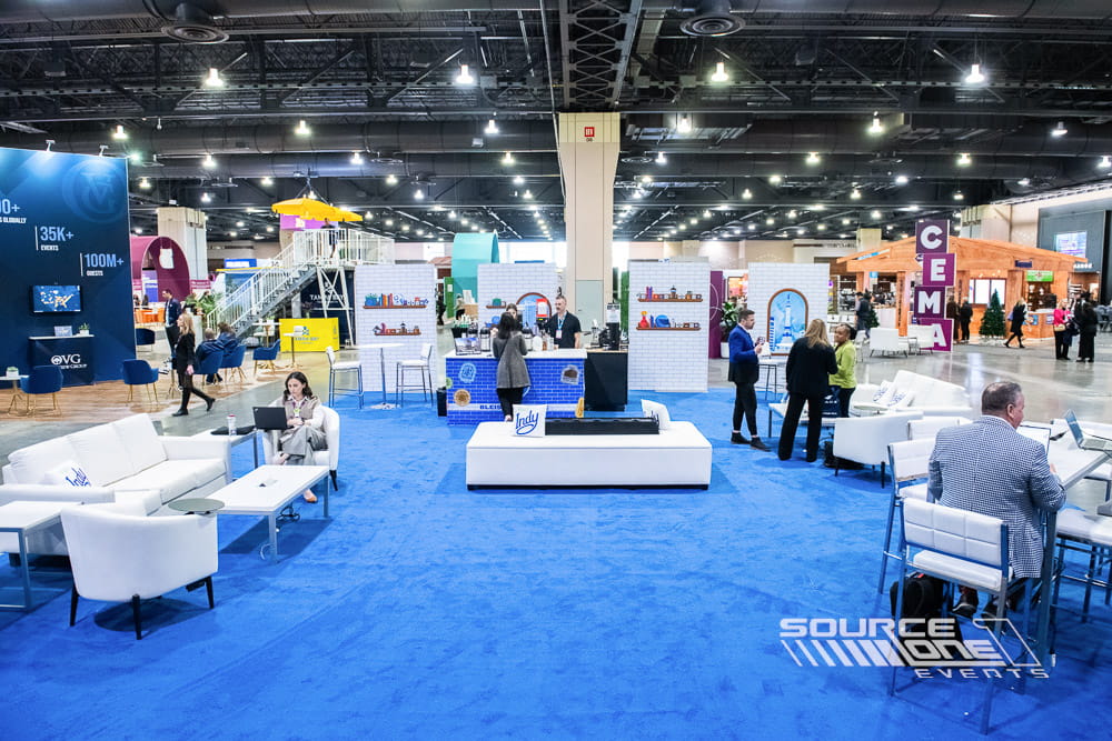 Destination marketing booth showcasing Indianapolis tourism with large-format graphics, open exhibit design, and welcoming hospitality space.