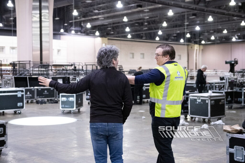Event staff coordinating exhibit installation and trade show setup.