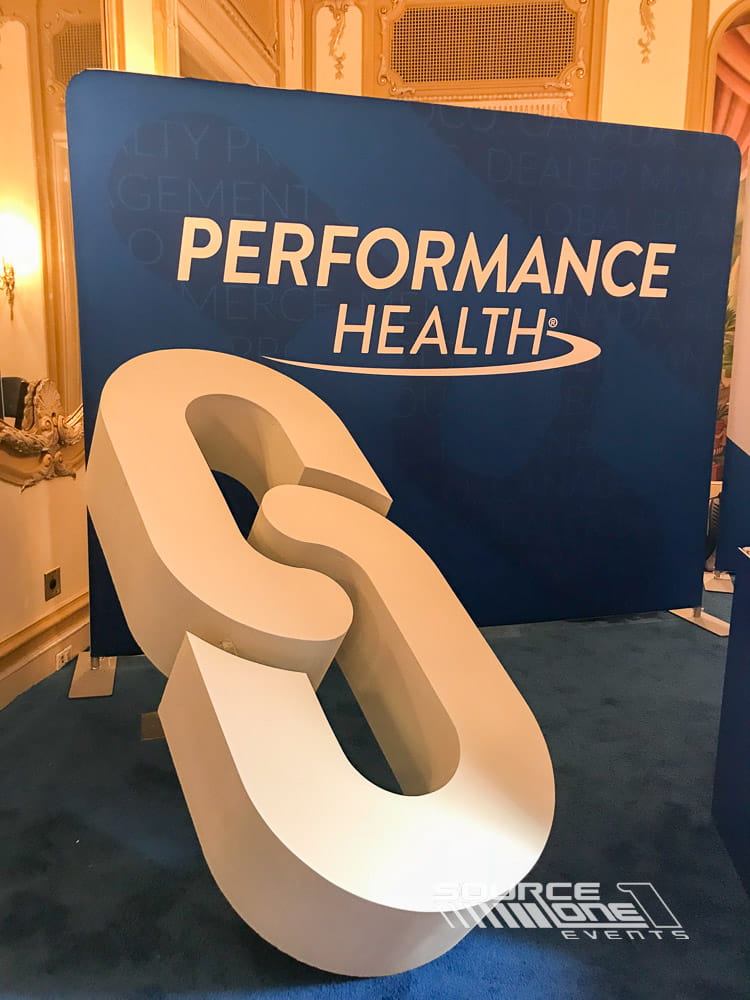 Oversized 3D logo installation used as branded event décor.