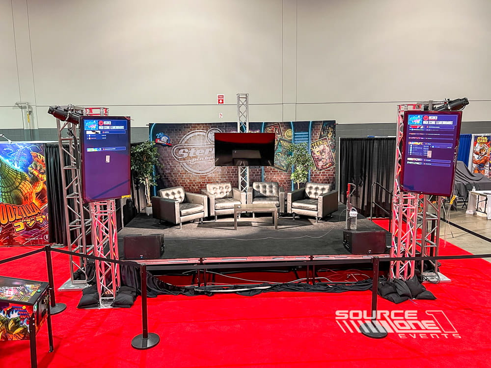 Custom Stern Pinball presentation stage featuring immersive LED displays, colorful branded graphics, gaming displays, and interactive audience experience.