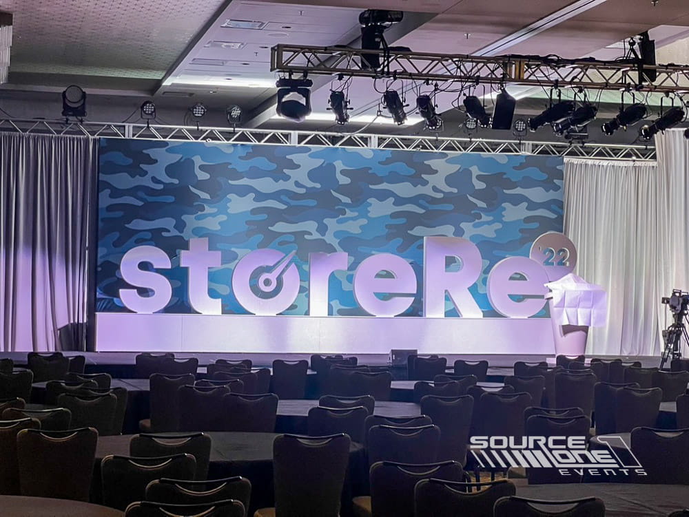 Large custom 3D logo letters creating a branded conference feature.