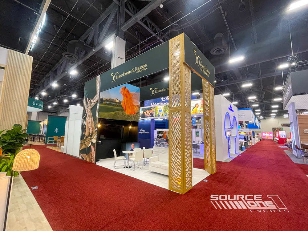 Hospitality trade show booth featuring large scenic graphics, branded architecture, and visitor engagement spaces.