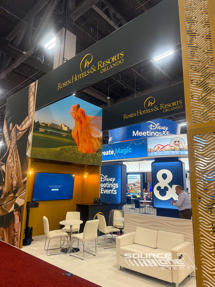 Large custom exhibit showcasing hotel branding through premium finishes and environmental graphics.