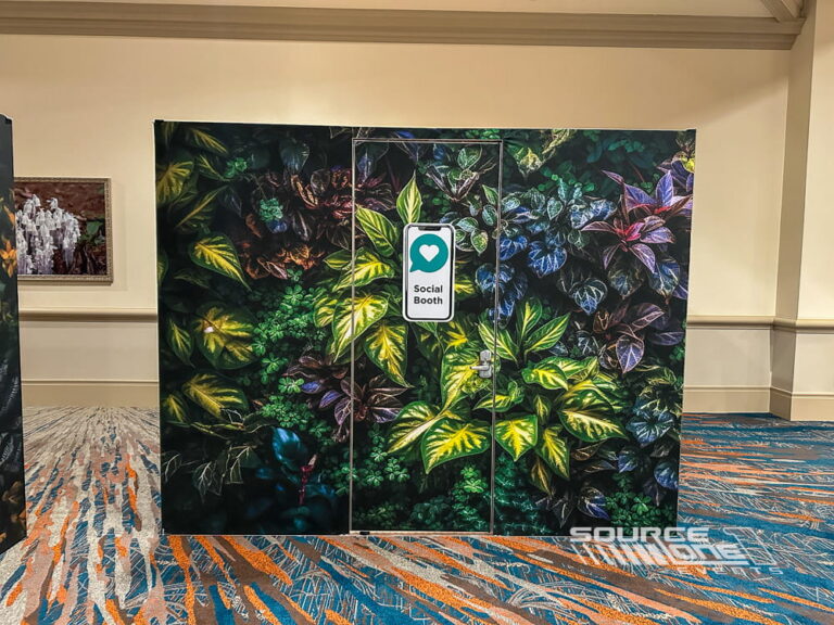 Private branded social media content room with botanical wall graphics, acoustic finishes, and modern event production design.