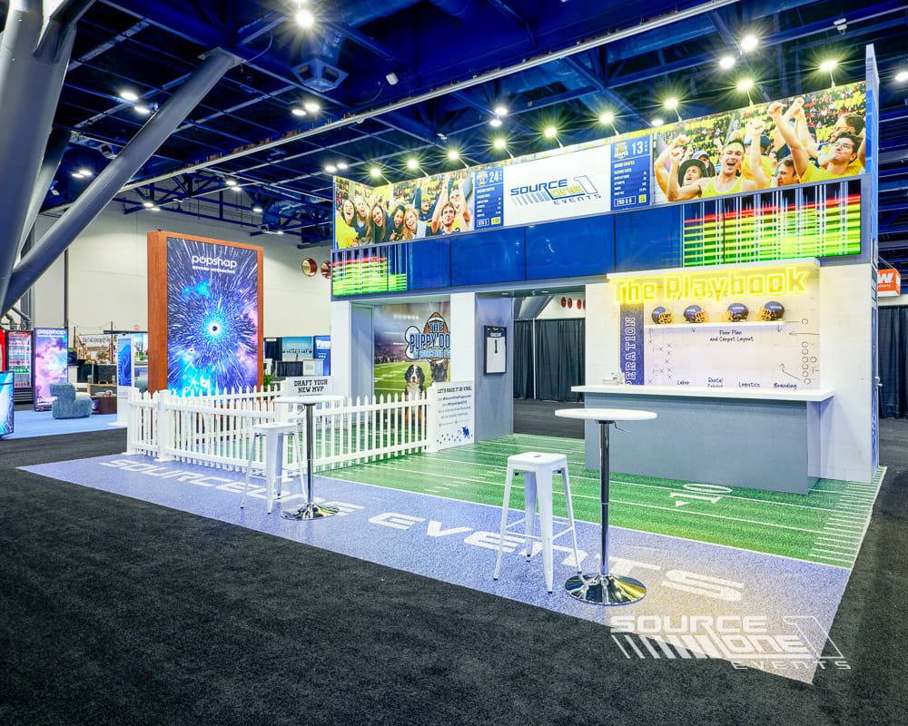 Source One Events custom trade show exhibit featuring large-format graphics, digital displays, and premium exhibit construction.
