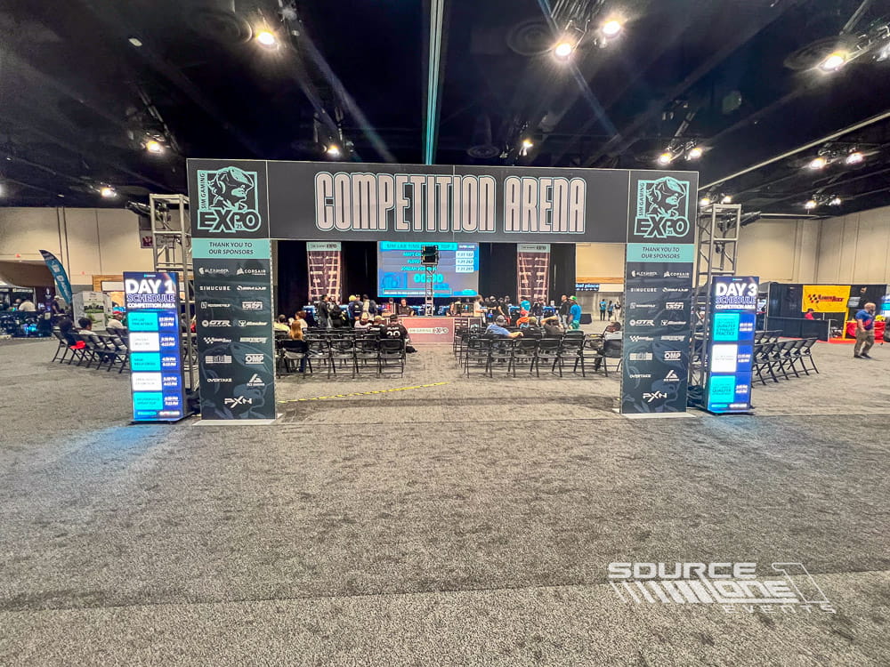 Large esports competition arena featuring massive LED displays, branded tournament staging, and spectator seating for live gaming events.