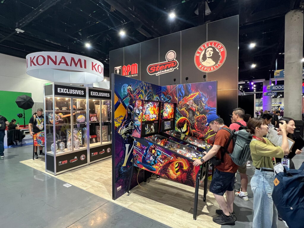 Interactive entertainment exhibit showcasing colorful pinball displays, themed graphics, and engaging gaming experiences.
