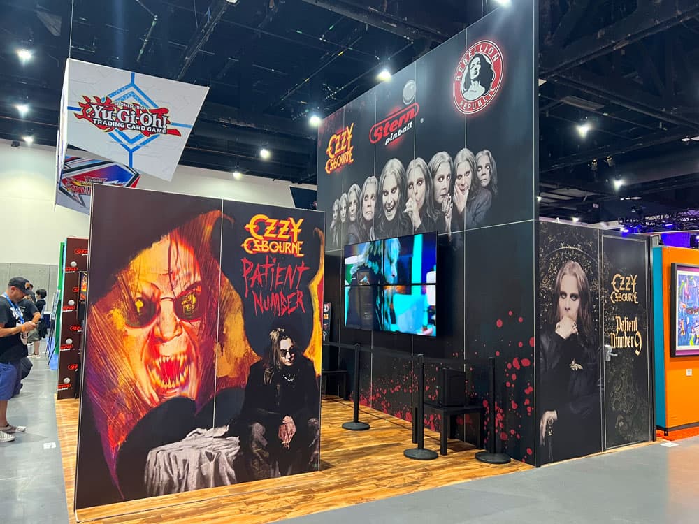 Branded experiential booth featuring collectible product showcase and graphics