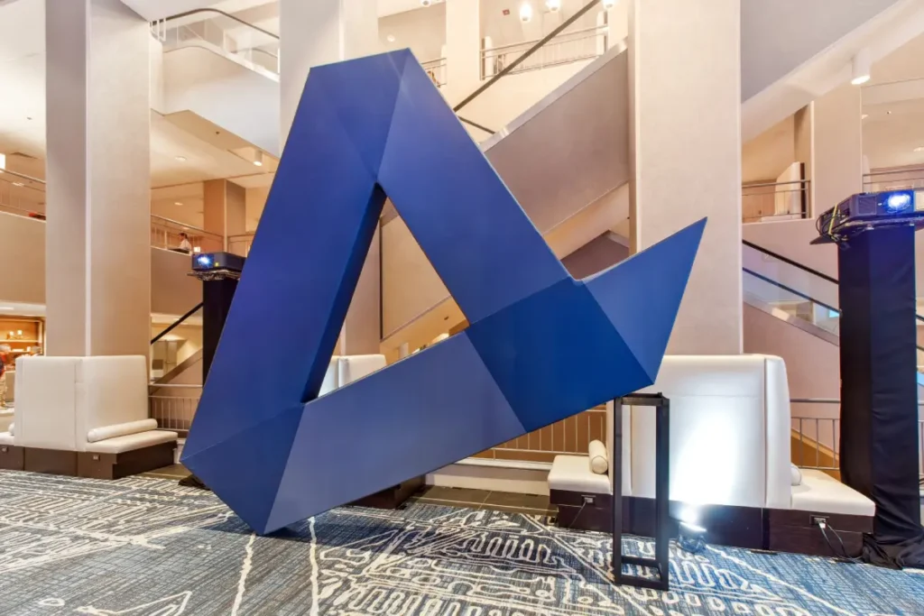 Custom geometric sculpture activation creating visual centerpiece at event