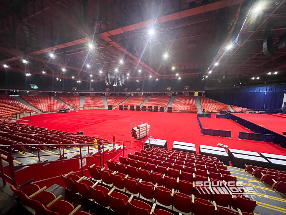 Custom flooring and staging prepared for a university commencement ceremony.